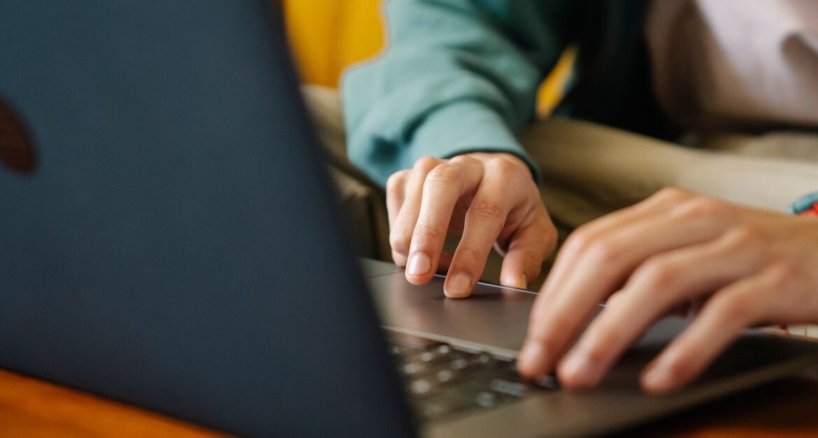 person laptop online scam
